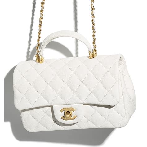 Chanel + Small Flap Bag With Top Handle .